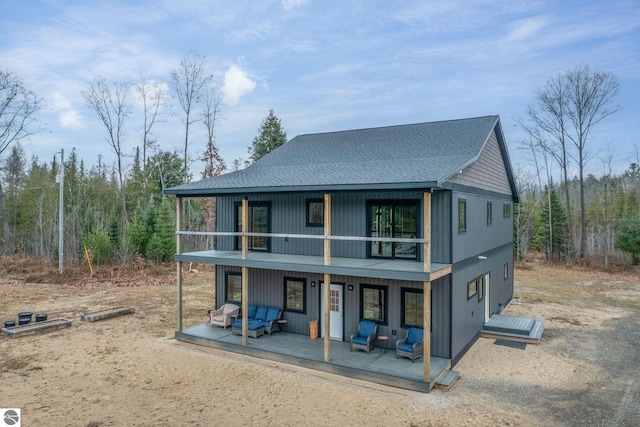 view of front of home with a balcony and an outdoor hangout area