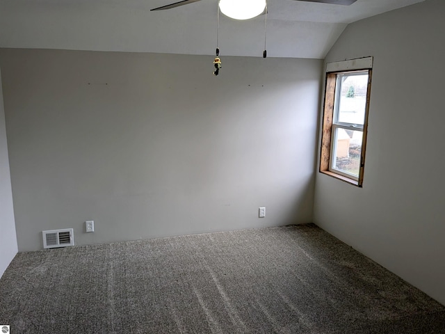 empty room featuring carpet flooring, ceiling fan, and lofted ceiling