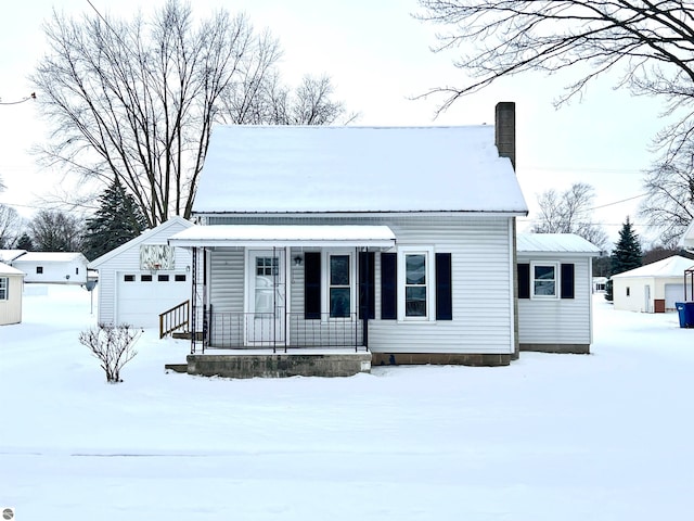 view of front facade featuring an outdoor structure and a garage