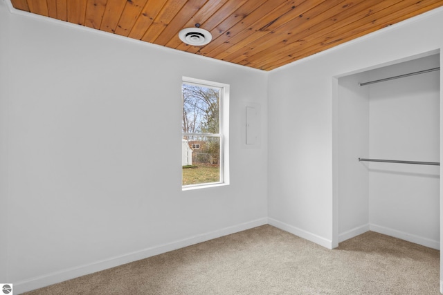 walk in closet featuring light carpet