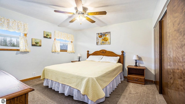 carpeted bedroom featuring a closet and ceiling fan