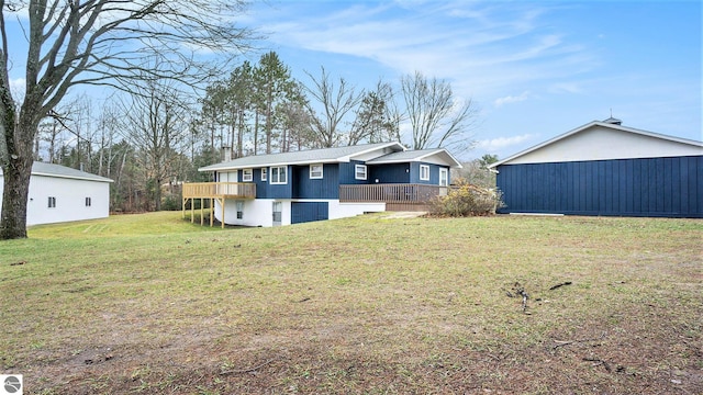 rear view of property with a lawn