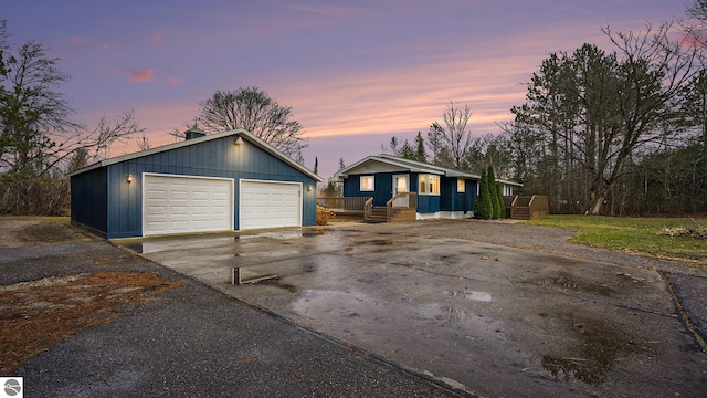 view of front facade featuring an outbuilding and a garage