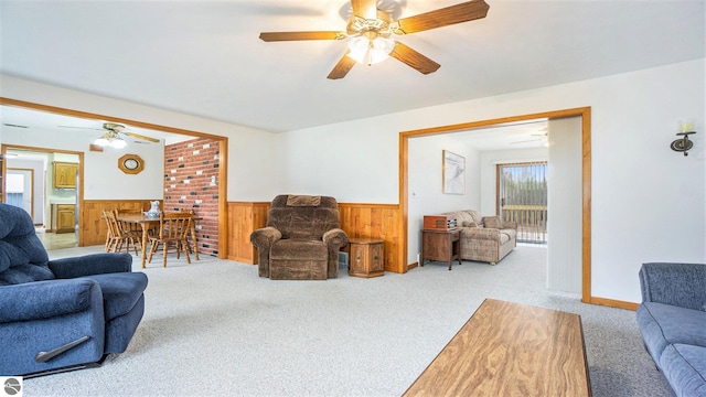 living room featuring wooden walls and carpet