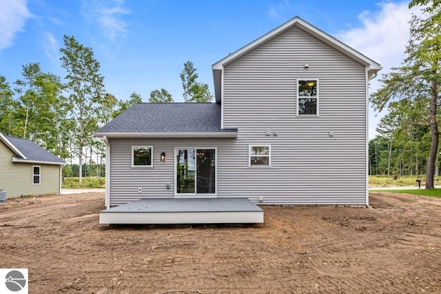 back of property featuring a deck