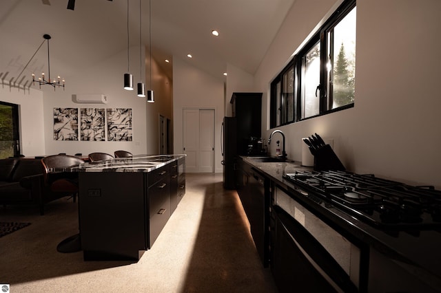 kitchen with pendant lighting, a breakfast bar, a center island, black appliances, and sink