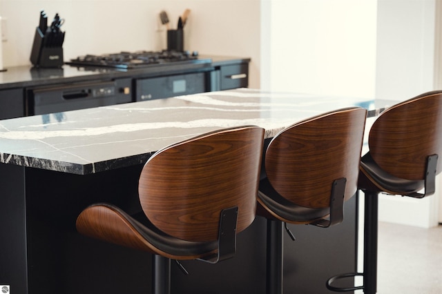 bar with oven and stainless steel gas stovetop