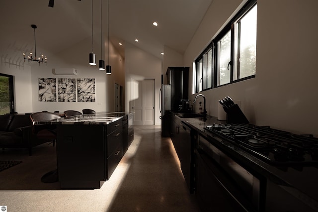 kitchen with a kitchen breakfast bar, black appliances, sink, a kitchen island, and hanging light fixtures