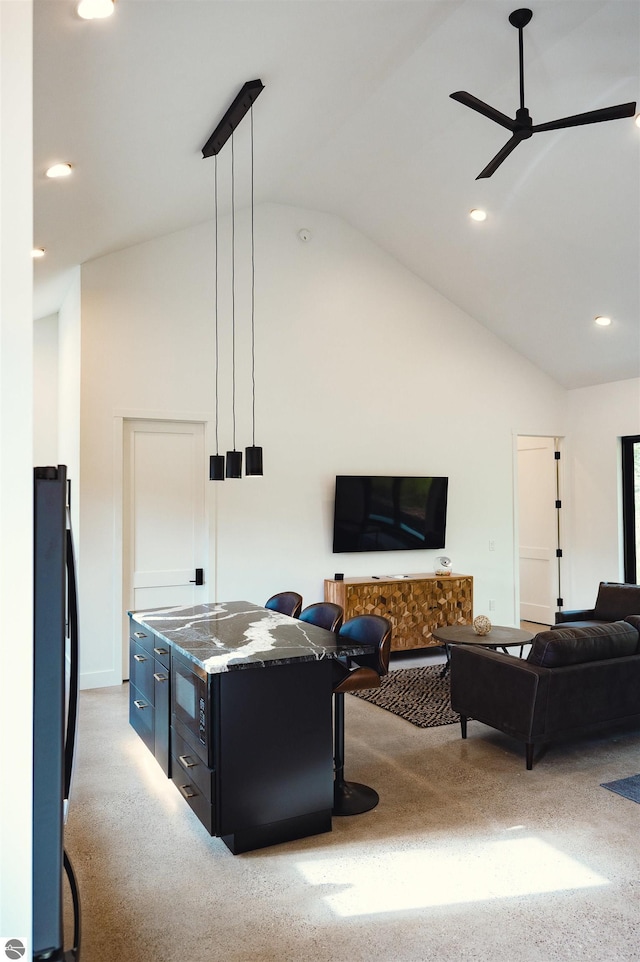 living room with ceiling fan, light carpet, and vaulted ceiling