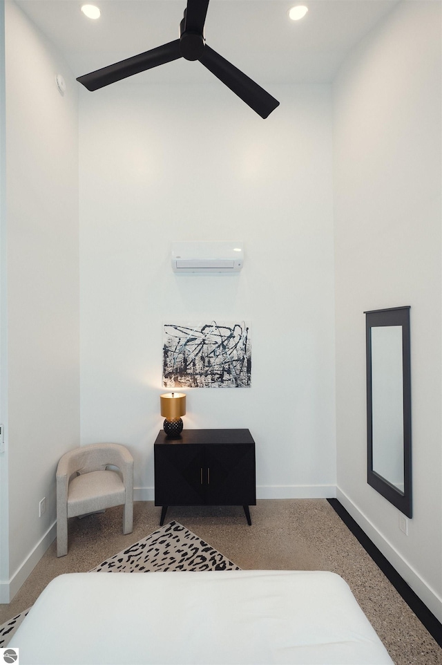 interior space featuring ceiling fan and a wall unit AC