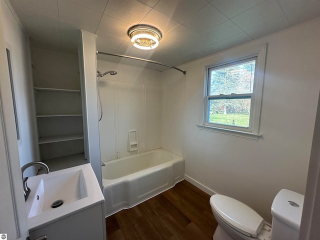 full bathroom featuring vanity, hardwood / wood-style flooring, toilet, and shower / bathtub combination