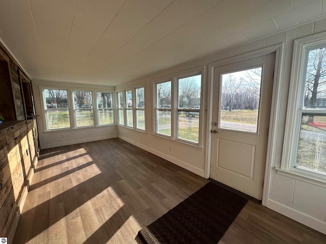 unfurnished sunroom with plenty of natural light