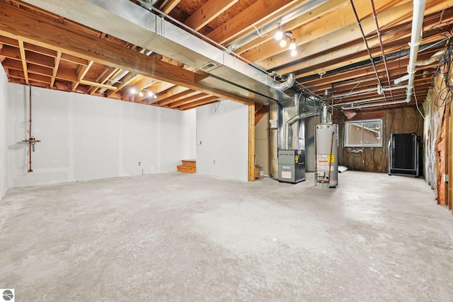 basement featuring heating unit and gas water heater