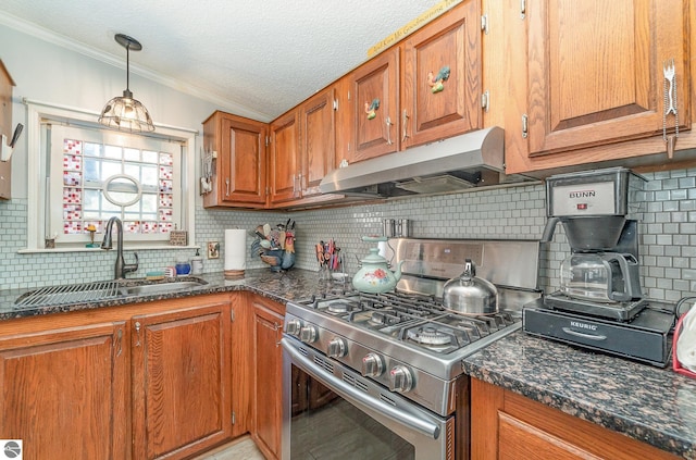 kitchen featuring sink, decorative light fixtures, decorative backsplash, stainless steel stove, and ornamental molding