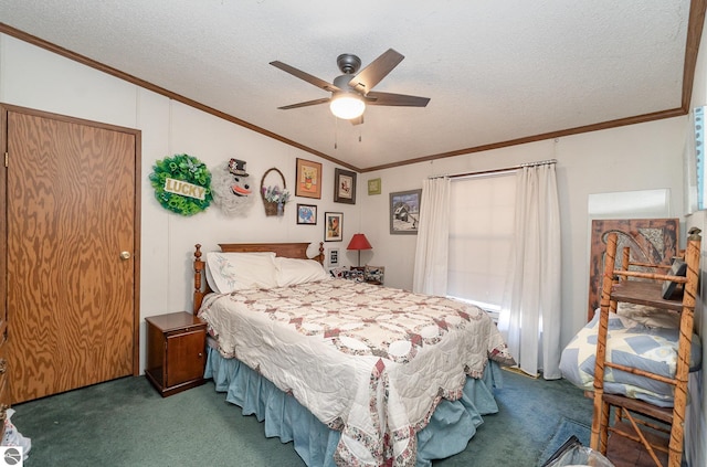 bedroom with dark colored carpet, a textured ceiling, ceiling fan, and crown molding