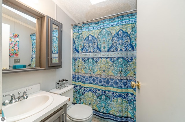 bathroom with a shower with shower curtain, vanity, toilet, and a textured ceiling