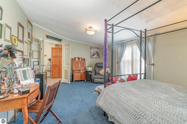 carpeted bedroom featuring ornamental molding and a textured ceiling