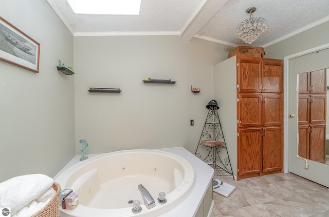 bathroom with ornamental molding, a textured ceiling, a bathing tub, and vaulted ceiling with skylight