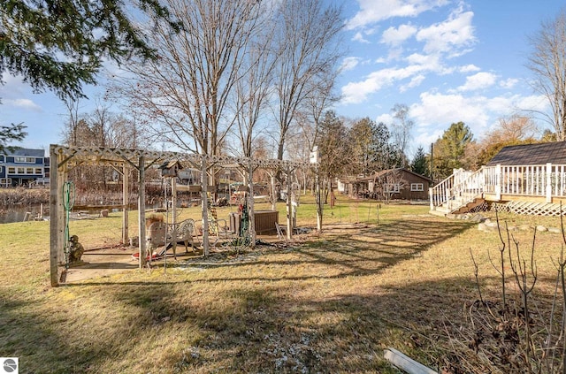 view of yard with a wooden deck