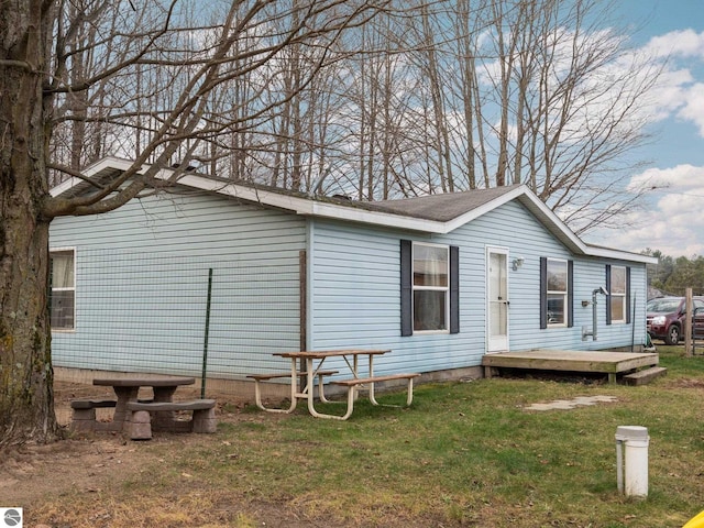 exterior space featuring a deck and a yard