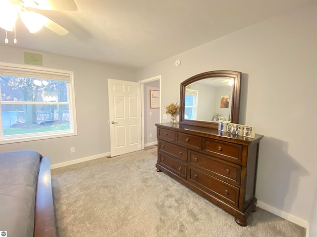 bedroom featuring ceiling fan and light colored carpet