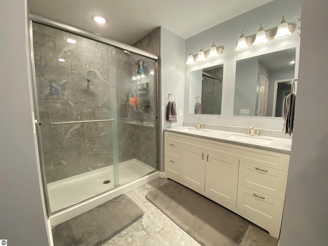 bathroom with vanity and an enclosed shower