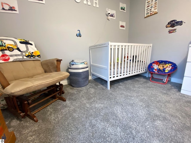 carpeted bedroom with a nursery area