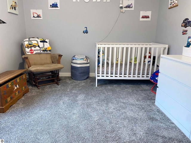 bedroom with dark carpet and a crib