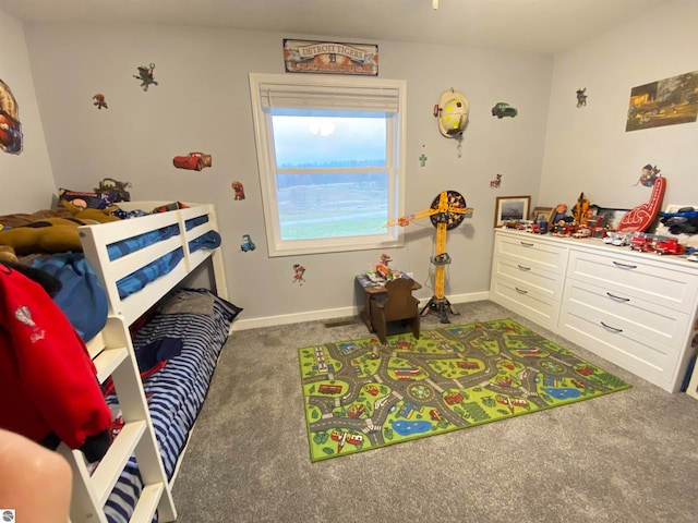 bedroom with dark colored carpet