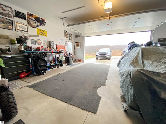 garage featuring a workshop area and a garage door opener