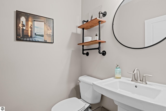 bathroom with toilet and sink