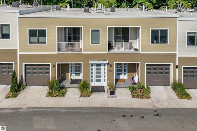 multi unit property featuring a garage