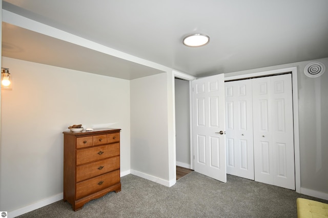 carpeted bedroom with a closet