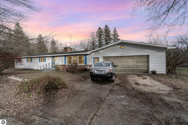 single story home with a garage