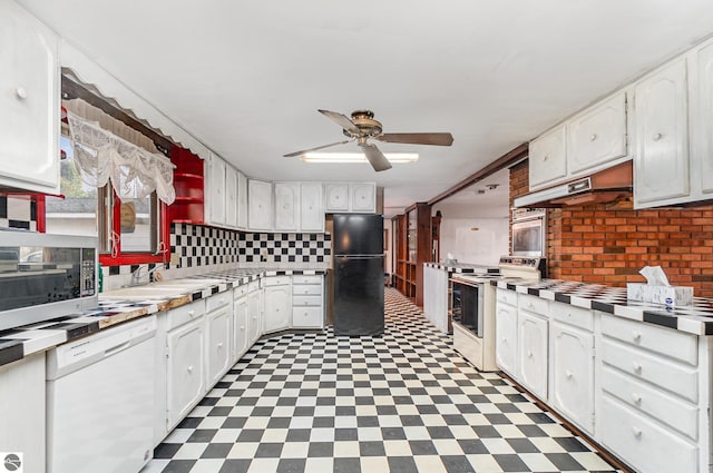 kitchen with appliances with stainless steel finishes, tasteful backsplash, ceiling fan, sink, and white cabinets