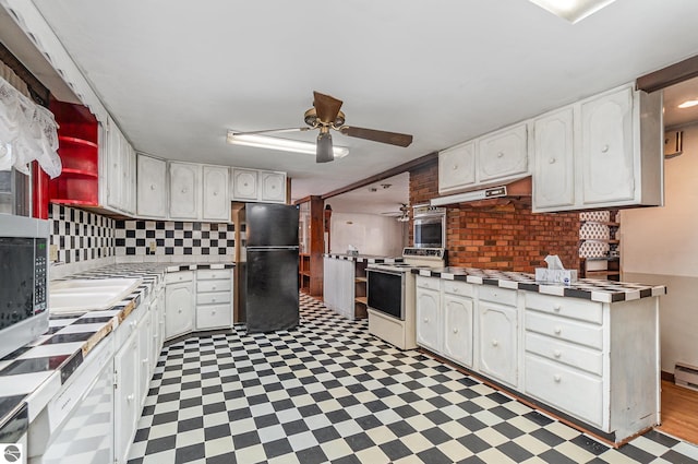 kitchen featuring white cabinetry, appliances with stainless steel finishes, and tasteful backsplash