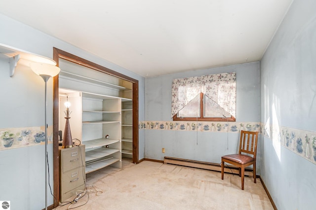 interior space featuring baseboard heating and light colored carpet