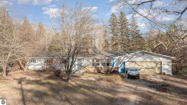 rear view of property with a garage