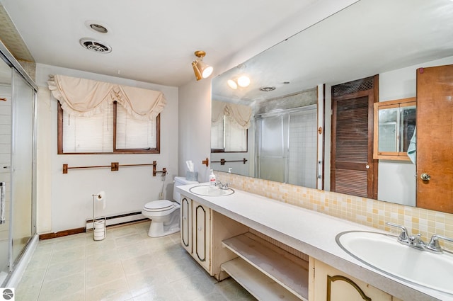 bathroom with decorative backsplash, vanity, a baseboard radiator, and a shower with shower door