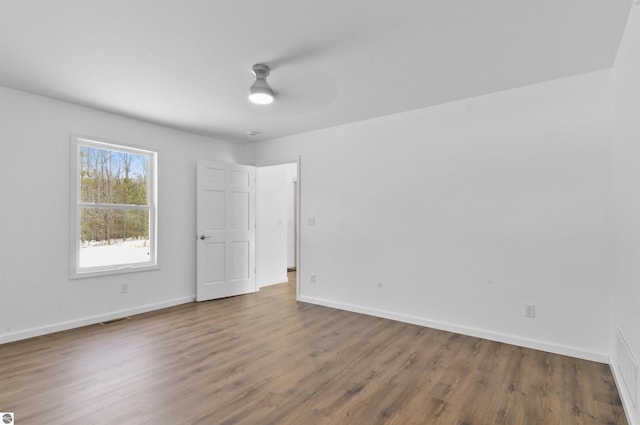 unfurnished room featuring hardwood / wood-style flooring and ceiling fan