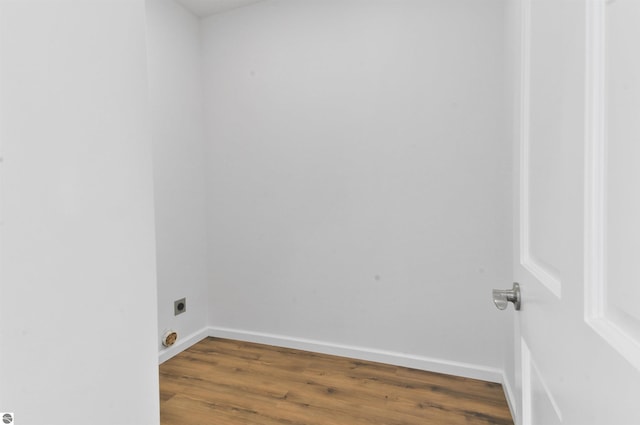 laundry area featuring hookup for an electric dryer and hardwood / wood-style flooring