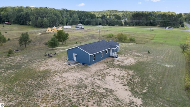 birds eye view of property with a rural view