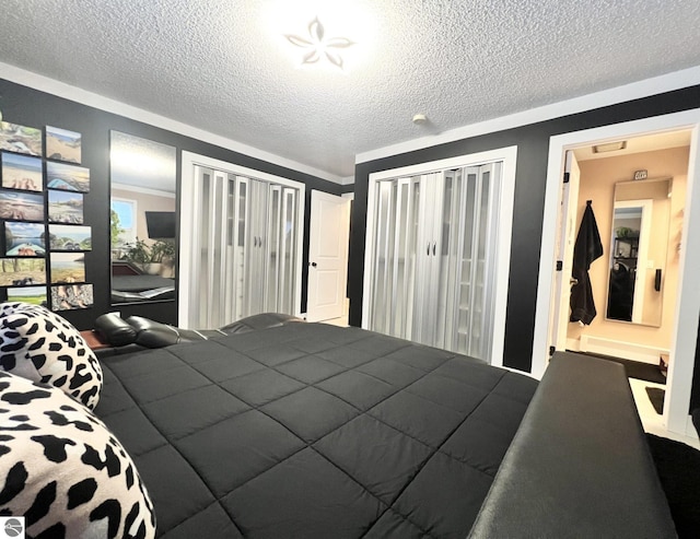 bedroom with ornamental molding and a textured ceiling