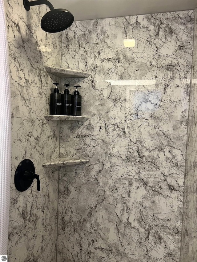 details featuring tiled shower