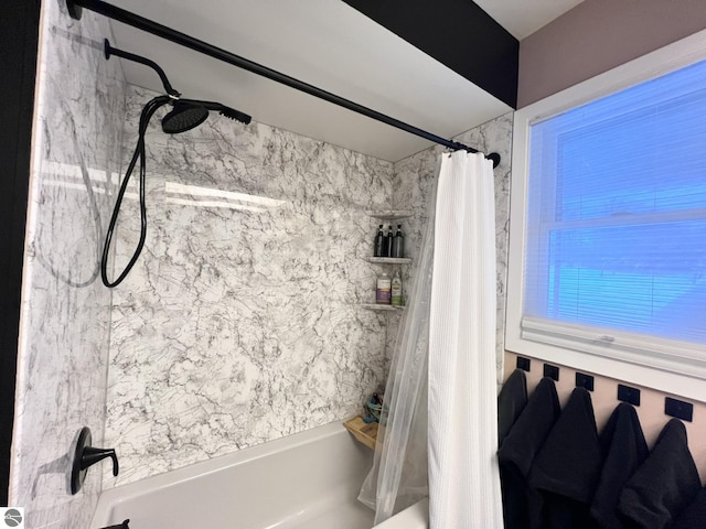 bathroom with shower / tub combo