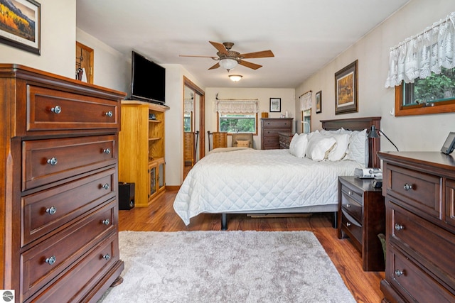 bedroom with light hardwood / wood-style floors and ceiling fan