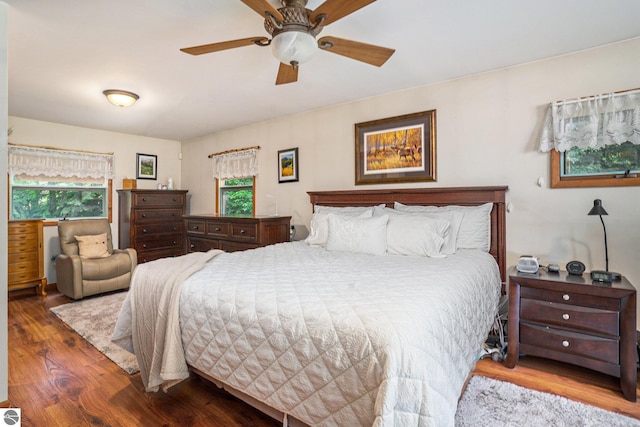 bedroom with hardwood / wood-style flooring and ceiling fan