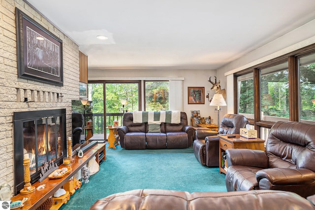 living room with a fireplace and carpet floors