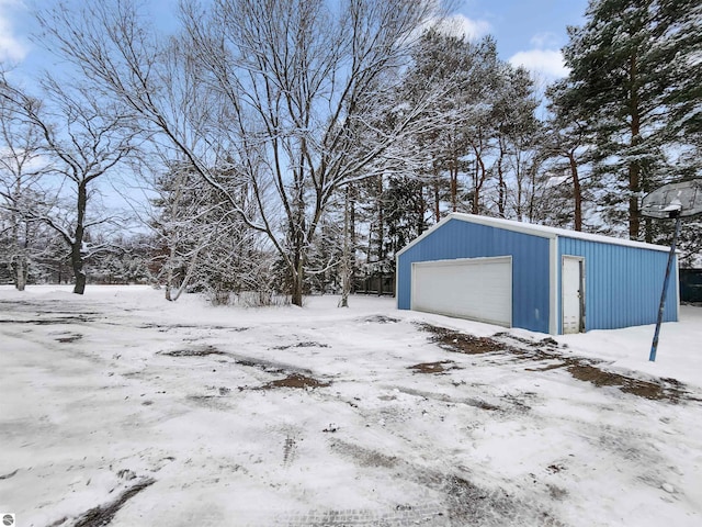 view of snow covered garage