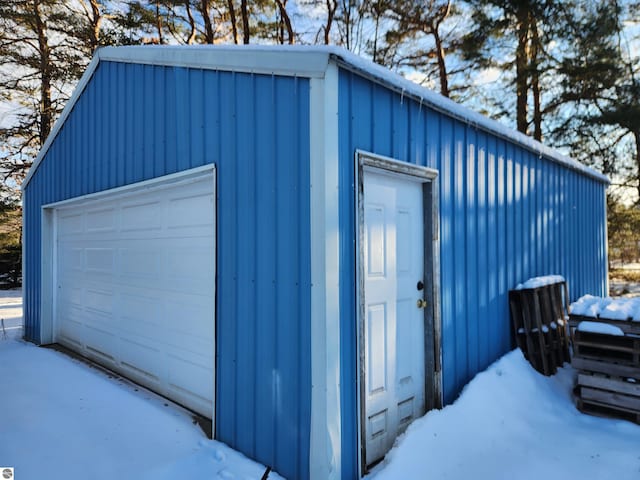 view of snow covered garage